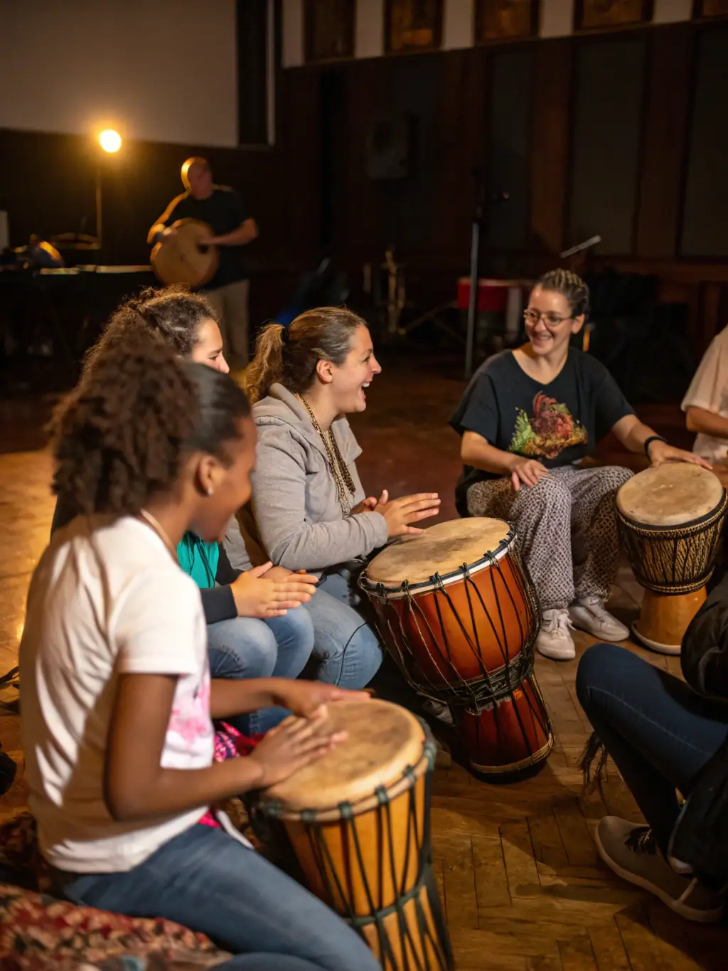 A lively scene from a community music workshop, showcasing participants of all ages learning to play instruments and create music together, reflecting FREESOUND's commitment to music education.